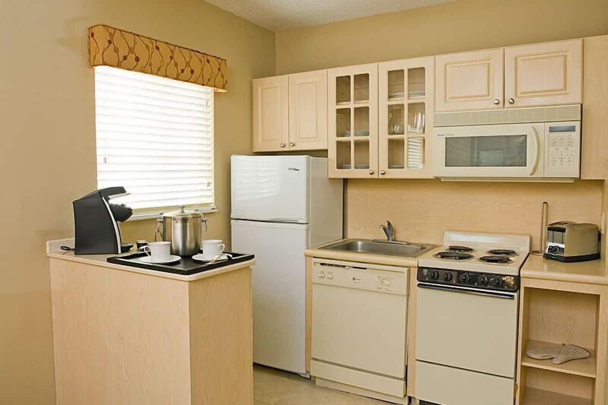 full-sized fridge, microwave, stovetop, dishwasher