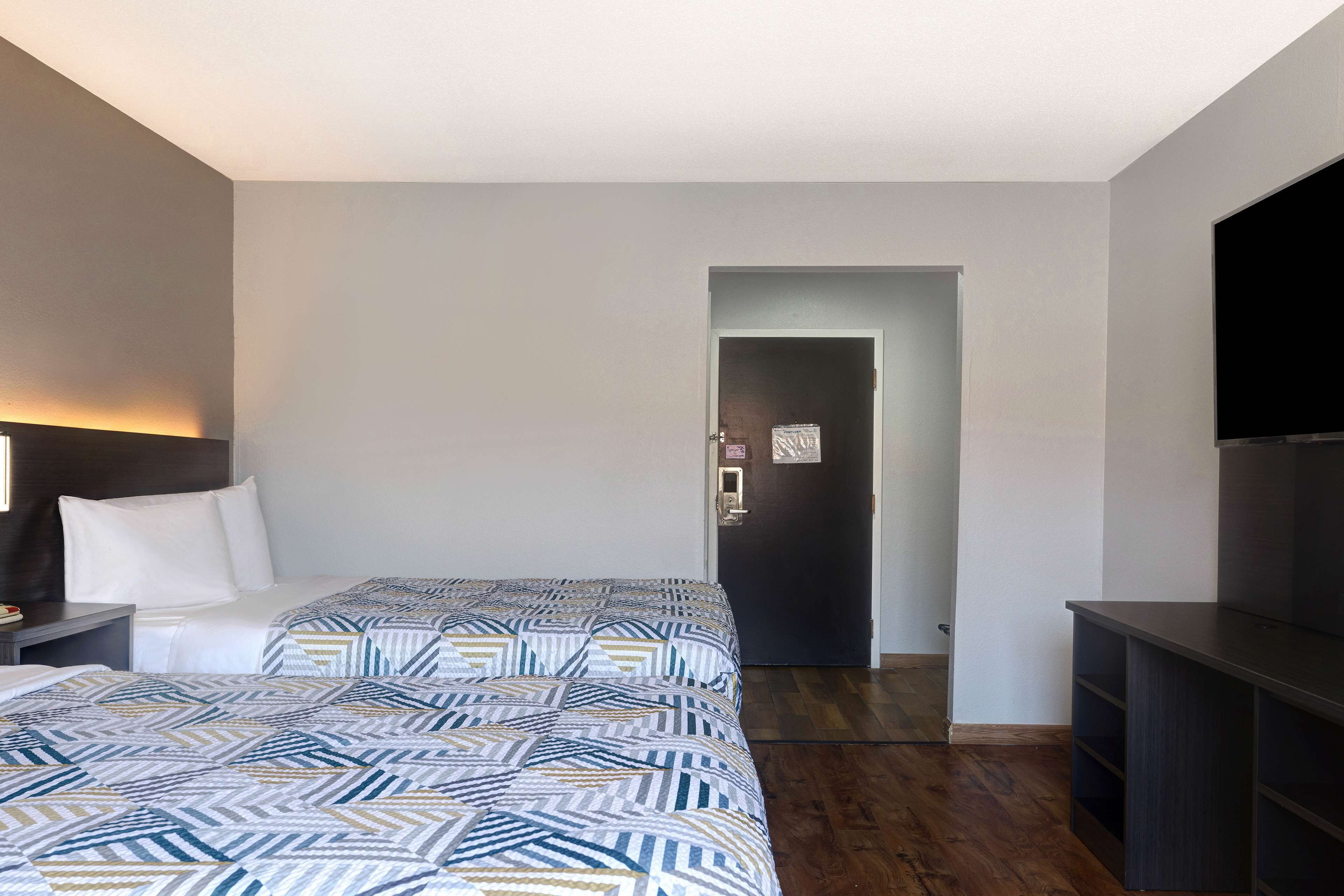 Standard Room, 2 Queen Beds, Non Smoking | Laptop workspace, WiFi (free), bed sheets