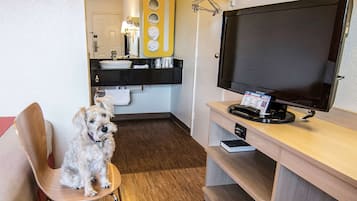 Laptop workspace, bed sheets