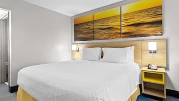 Desk, laptop workspace, blackout drapes, iron/ironing board