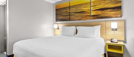 Desk, laptop workspace, blackout drapes, iron/ironing board