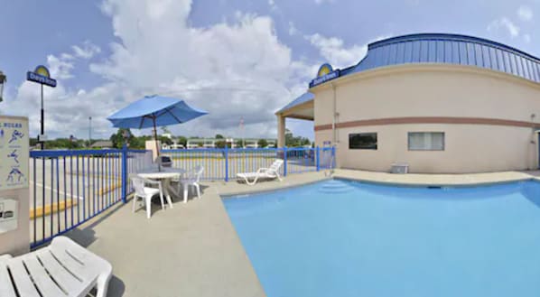 Seasonal outdoor pool, open 9 AM to 10 PM, pool loungers