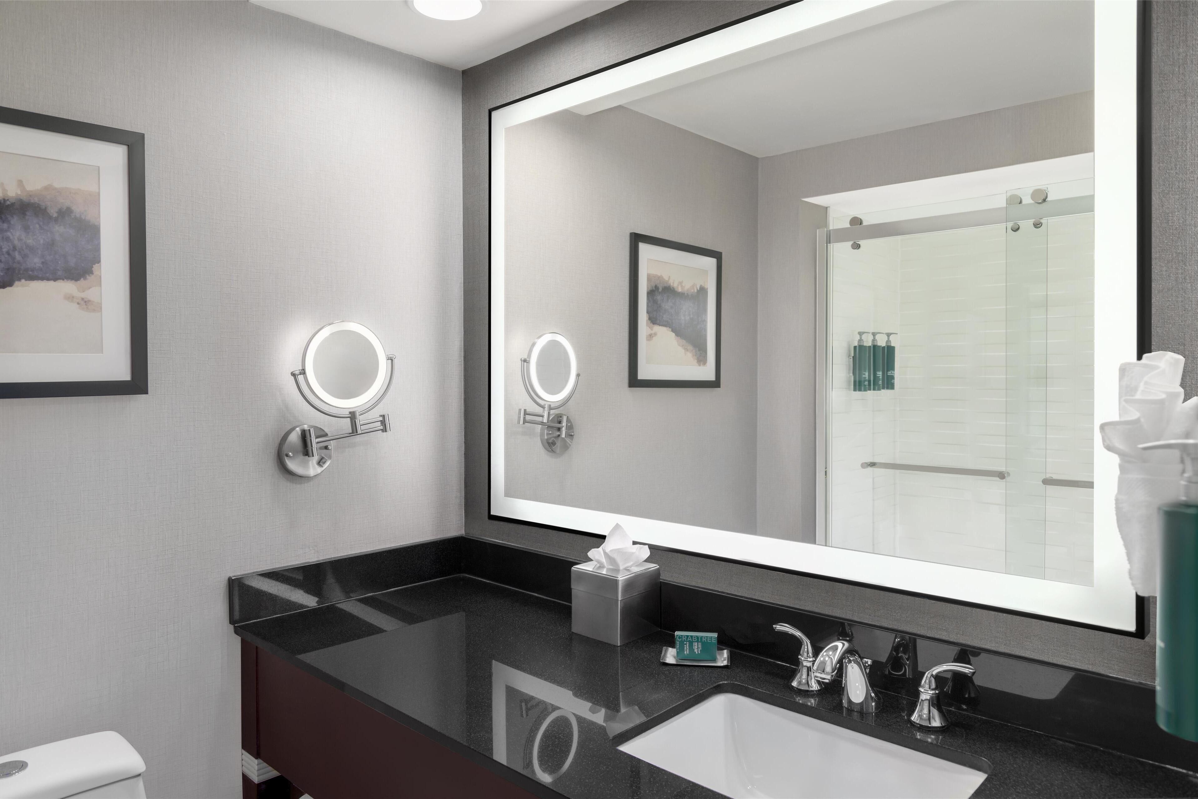 combined shower/bathtub, designer toiletries, hair dryer, towels