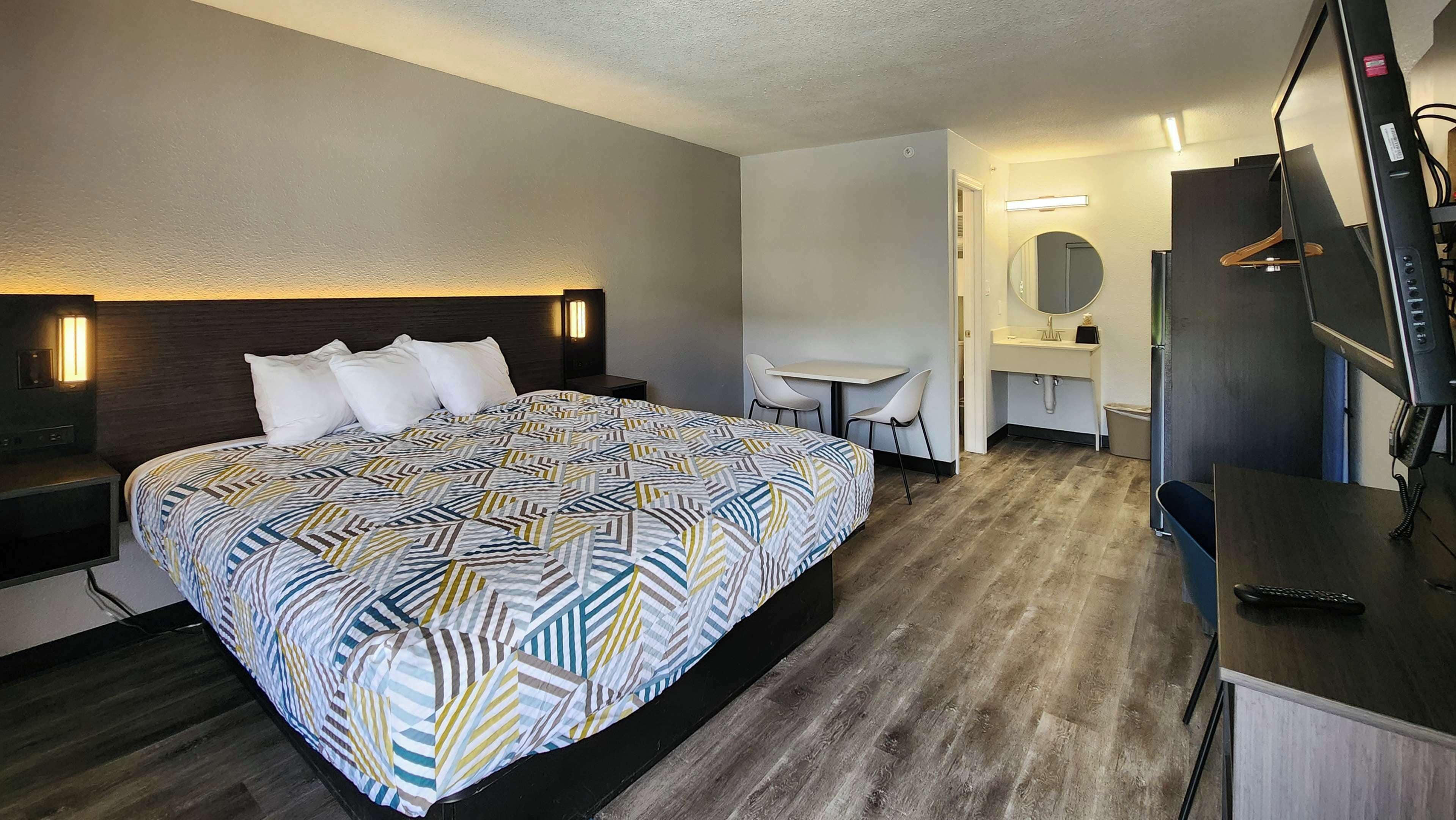 Desk, laptop workspace, blackout drapes, iron/ironing board