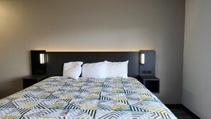 Desk, laptop workspace, blackout drapes, iron/ironing board