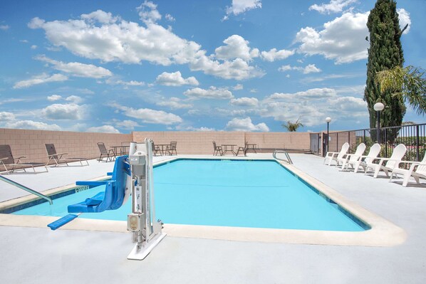 Outdoor pool, open 11:00 AM to 6:00 PM, pool umbrellas, sun loungers