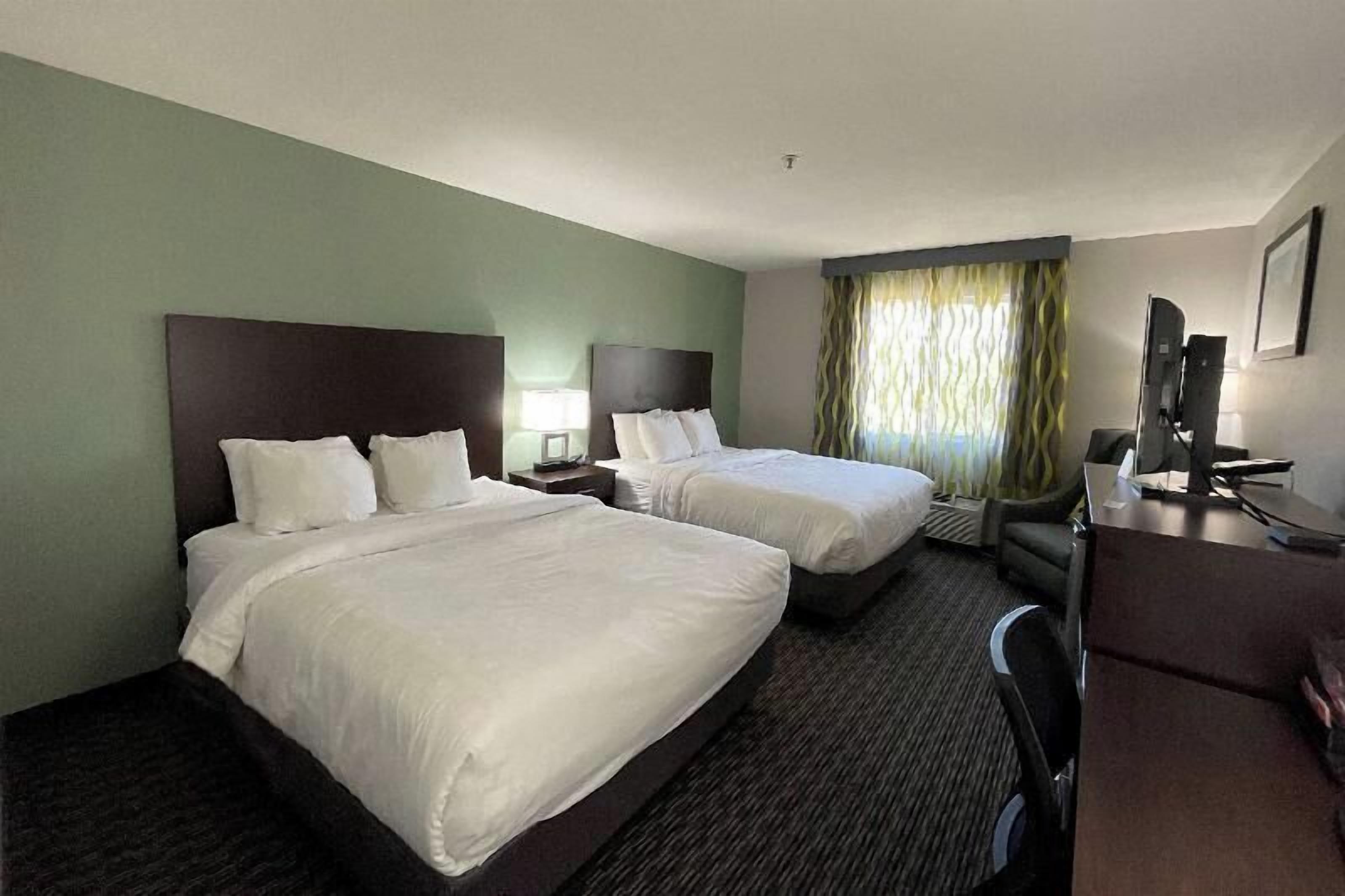 Premium bedding, desk, laptop workspace, soundproofing