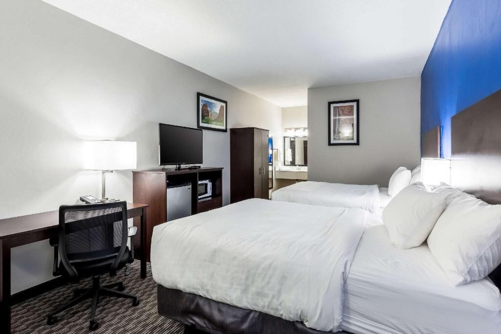 Premium bedding, desk, laptop workspace, soundproofing