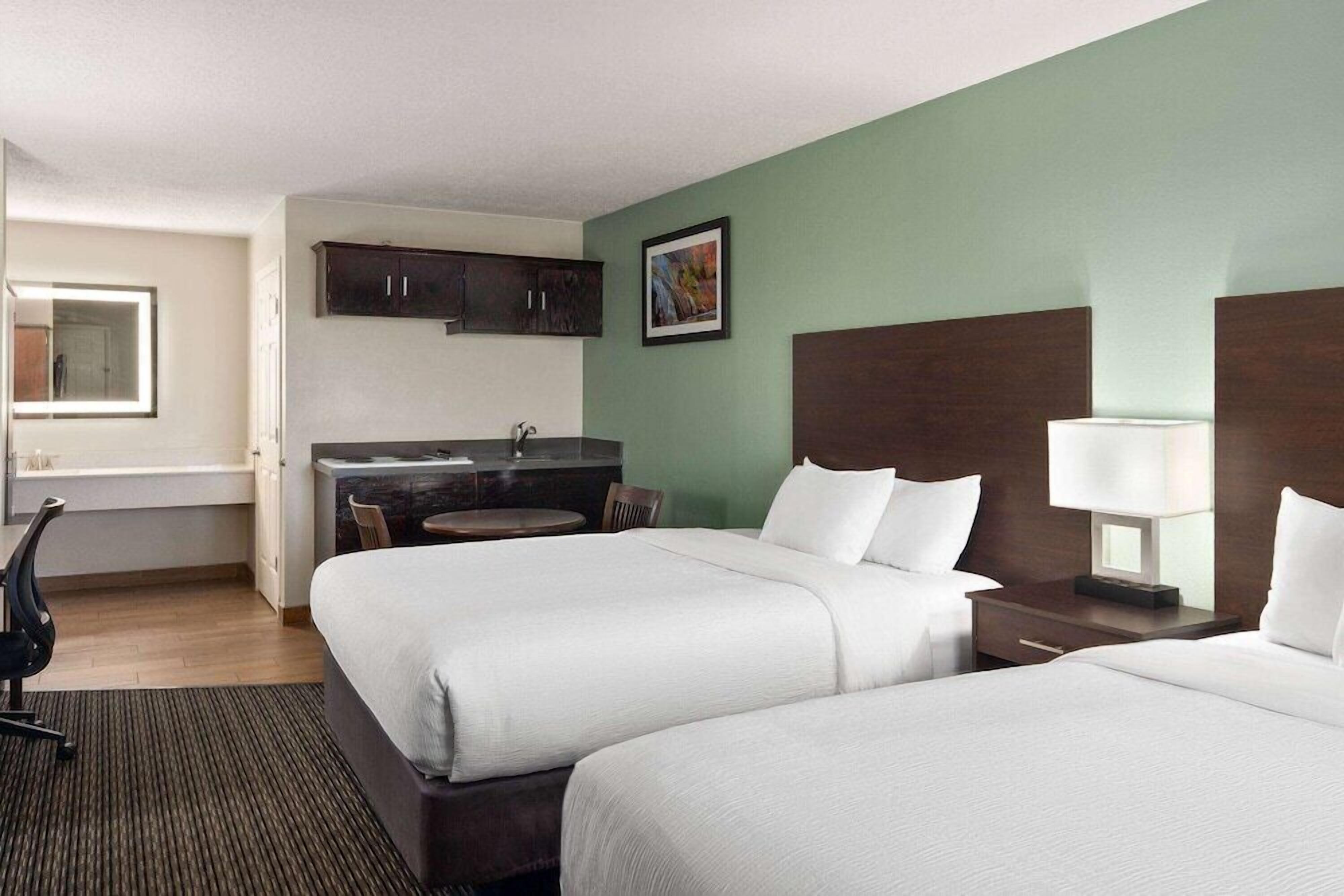 Premium bedding, desk, laptop workspace, soundproofing