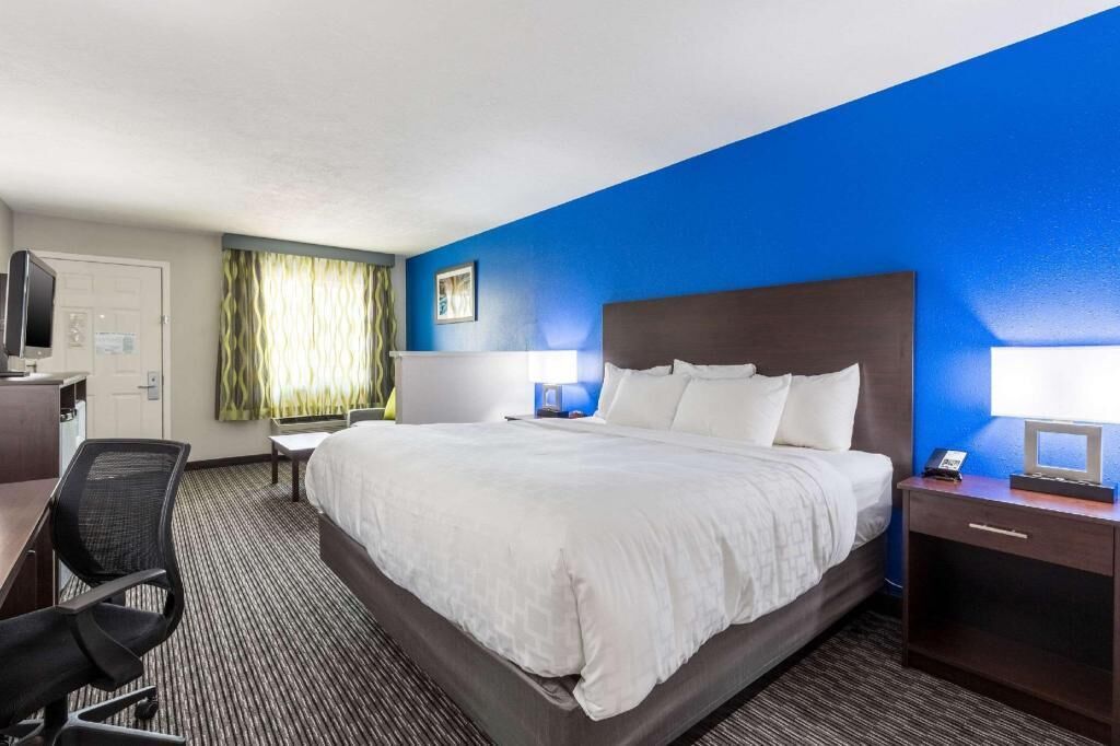 Premium bedding, desk, laptop workspace, soundproofing