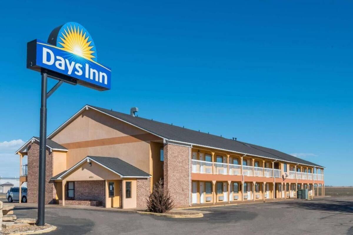 A Days Inn with a large sign, a two-story building, and a parking lot.