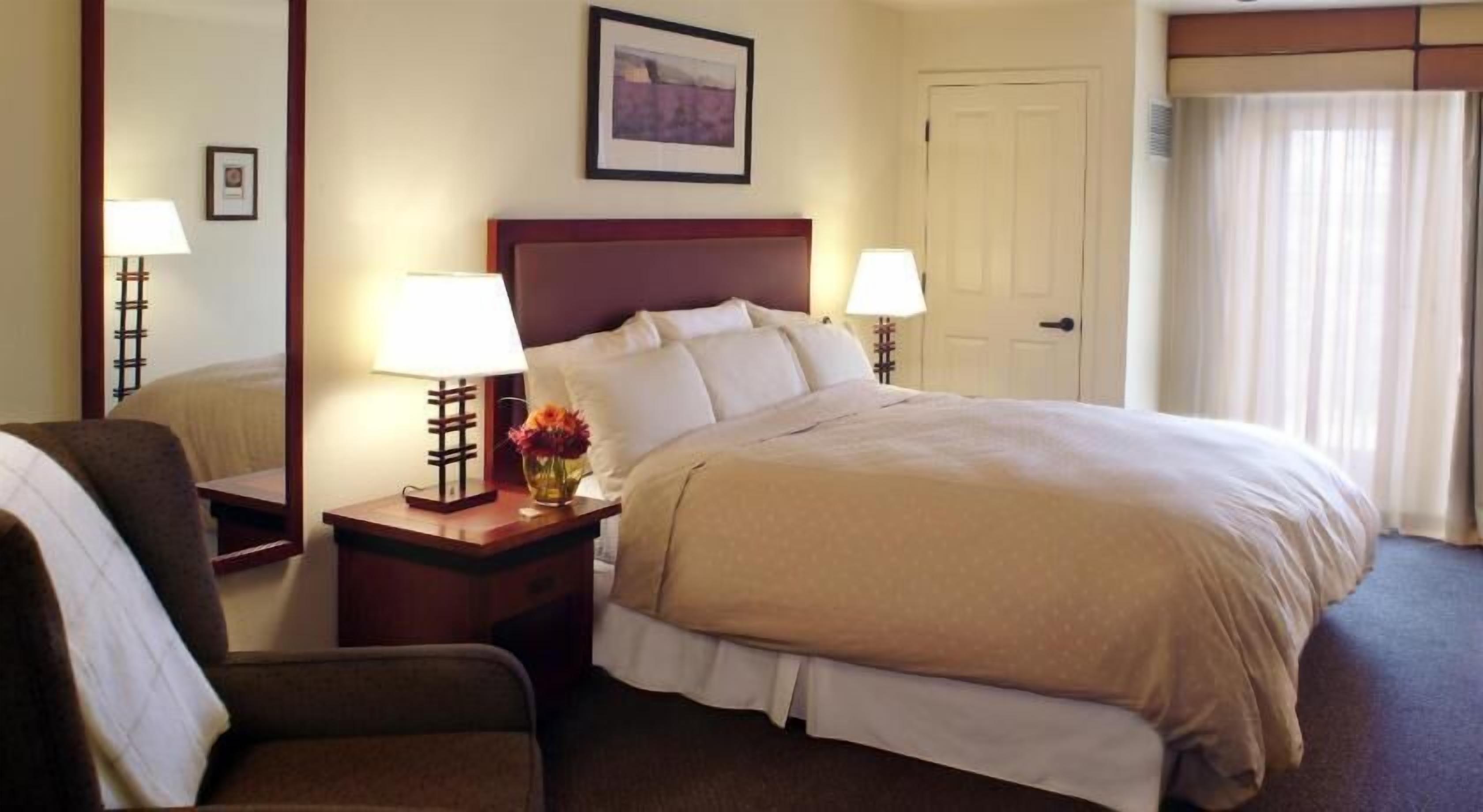 Premium bedding, desk, laptop workspace, blackout curtains