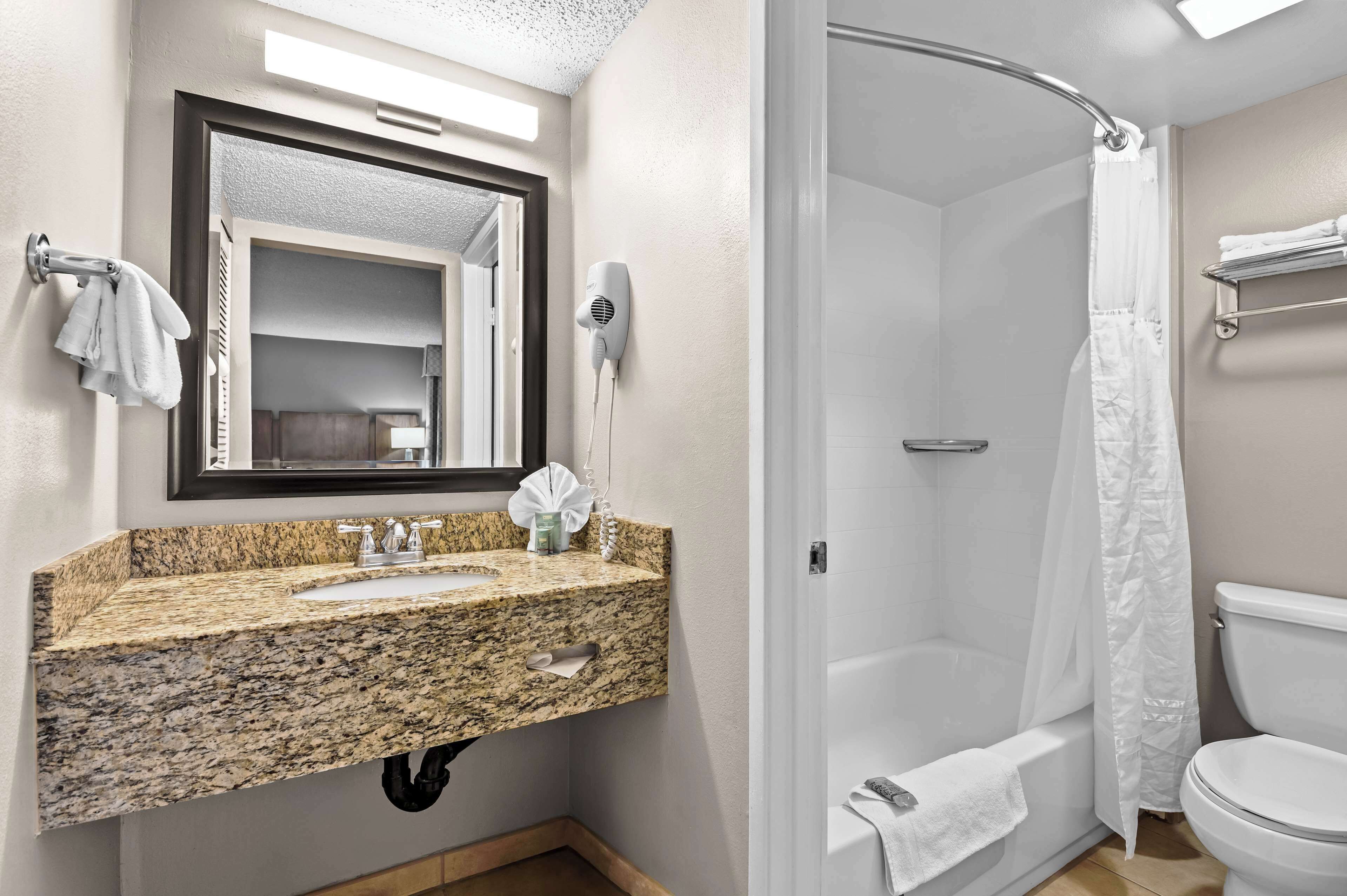 suite, 1 king bed, non smoking, refrigerator & microwave | bathroom | combined shower/bathtub, free toiletries, hair dryer, towels