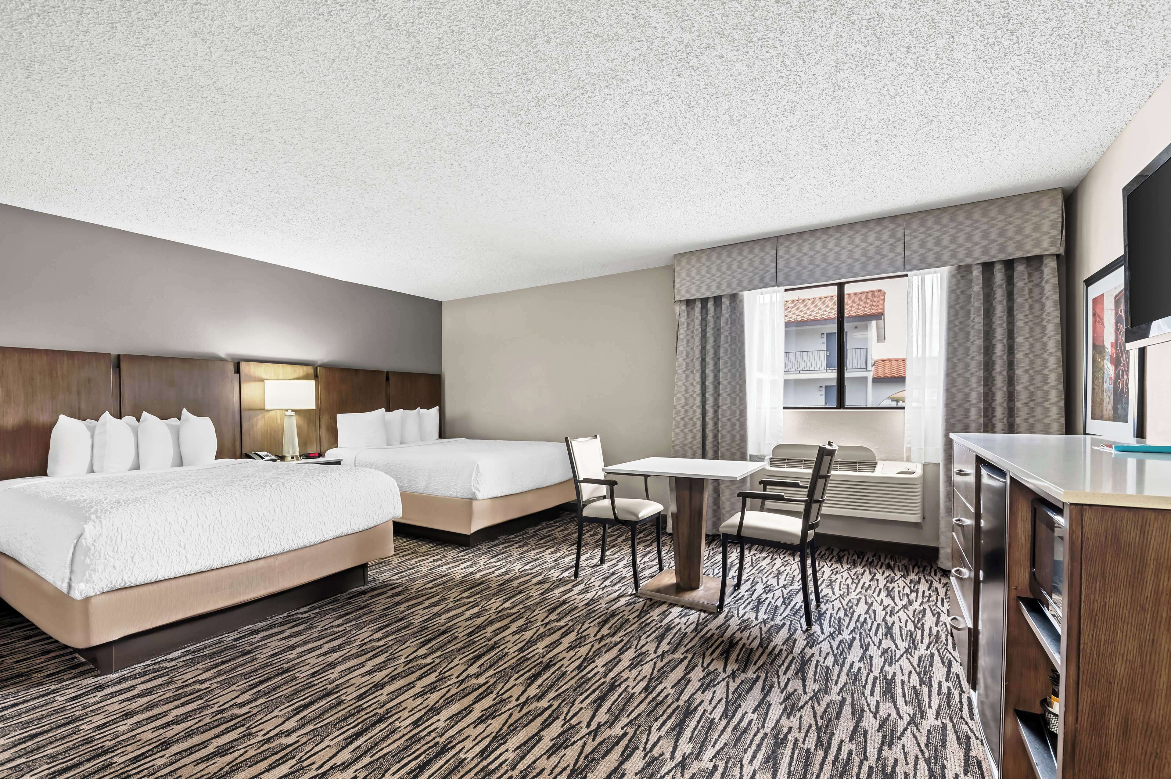 suite, 2 queen beds, non smoking, refrigerator & microwave | 1 bedroom, in-room safe, desk, iron/ironing board