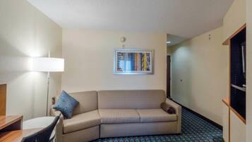 Suite, 1 King Bed | Living area | 32-inch flat-screen TV with cable channels, TV