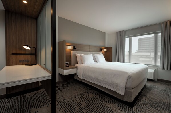 Premium bedding, desk, laptop workspace, blackout curtains