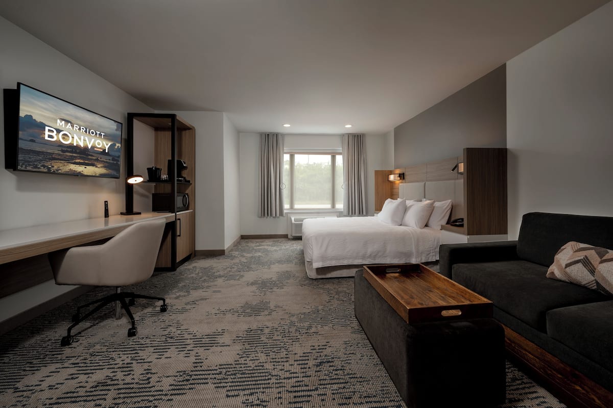 Premium bedding, desk, laptop workspace, blackout curtains