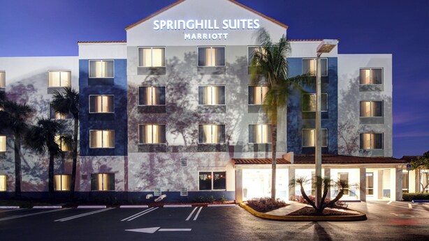 A multi-story hotel with a modern design, featuring a prominent sign for 'Springhill Suites Marriott'. - SpringHill Suites Port St. Lucie (Port Saint Lucie)