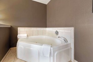 Suite, 1 King Bed, Non Smoking, Jetted Tub | Desk, blackout drapes, iron/ironing board, free WiFi