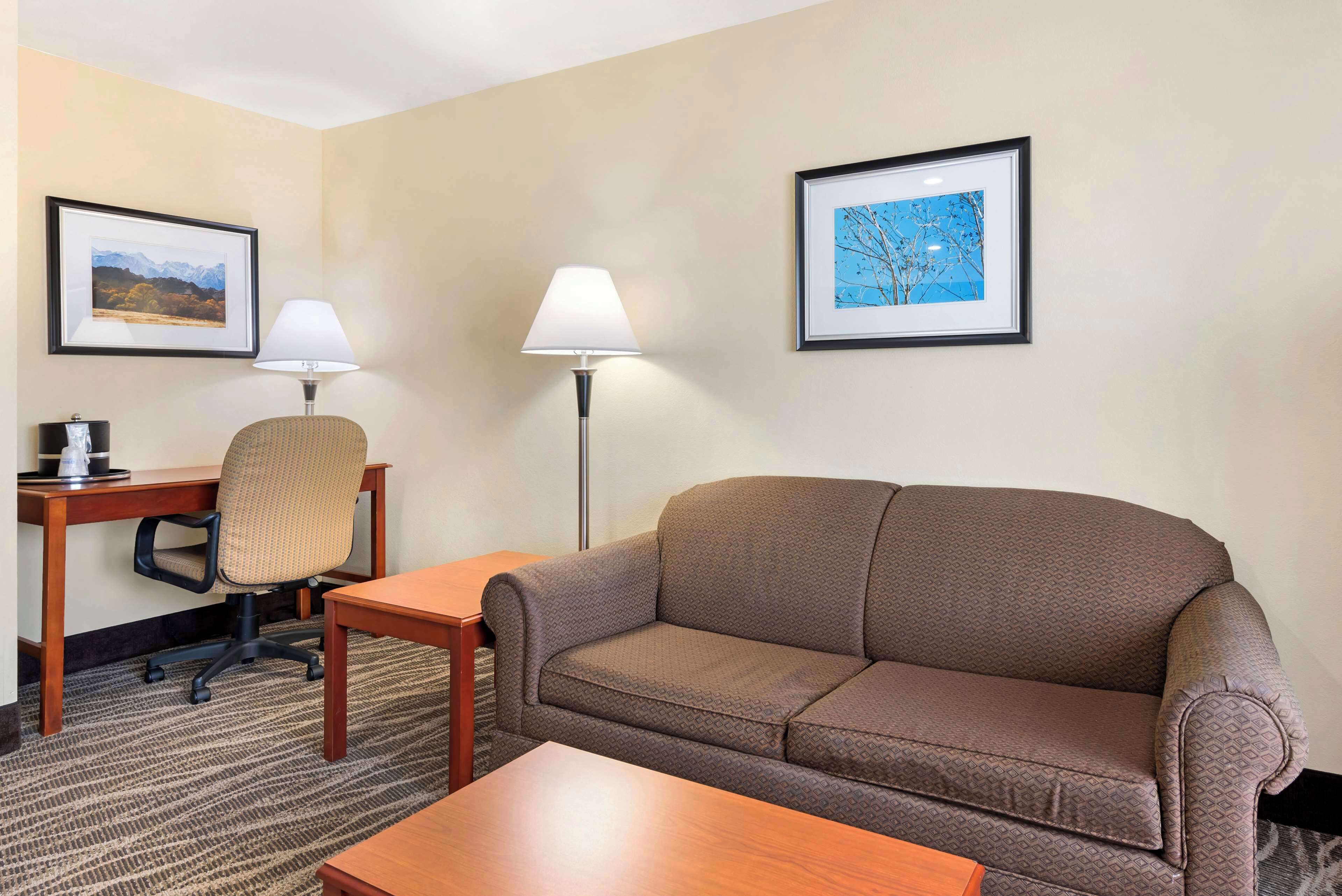 suite, 1 king bed, non smoking, jetted tub | desk, blackout curtains, iron/ironing board, free wifi