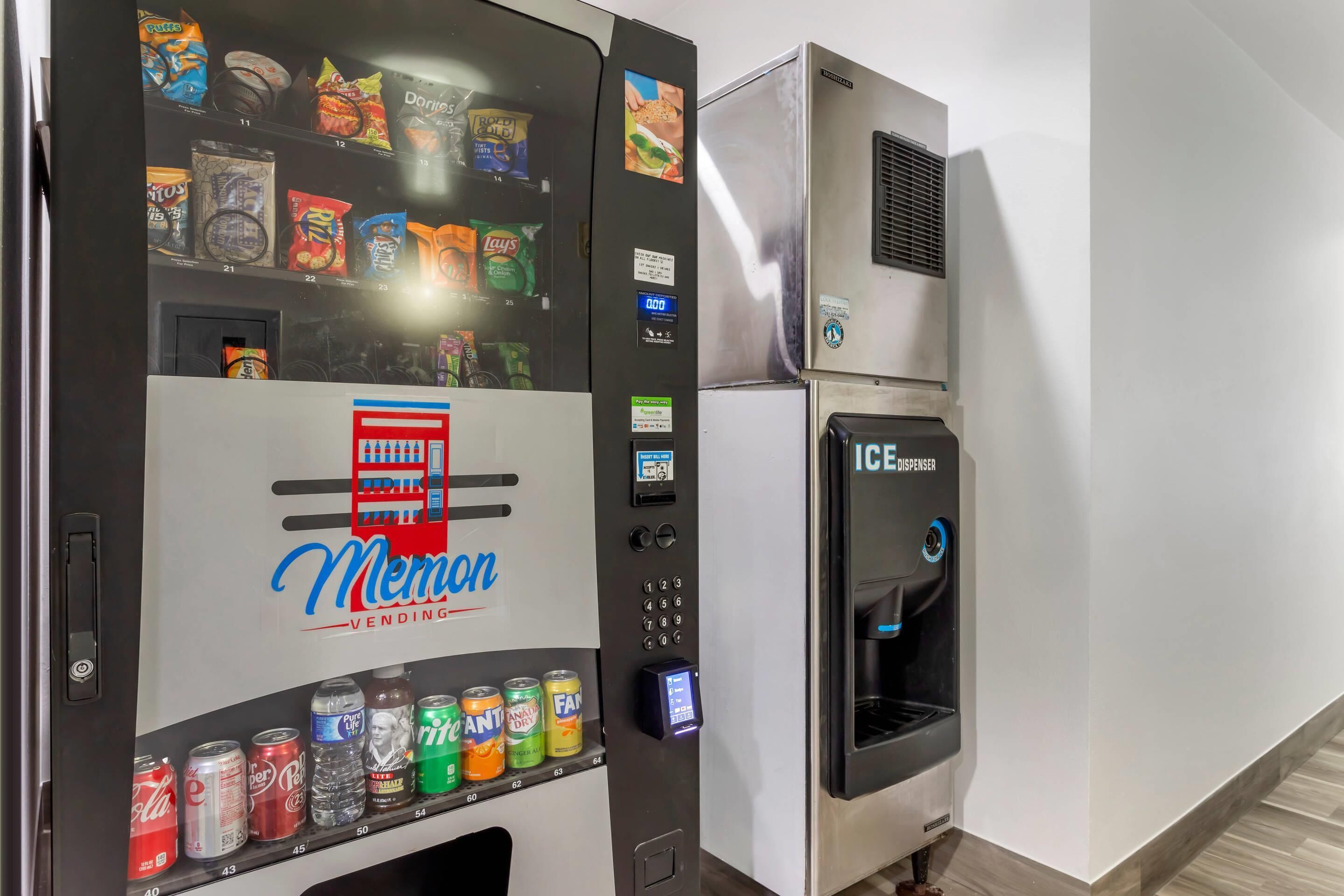 A vending machine with a variety of snacks and drinks, including Coca-Cola, Fanta, and Lay's.