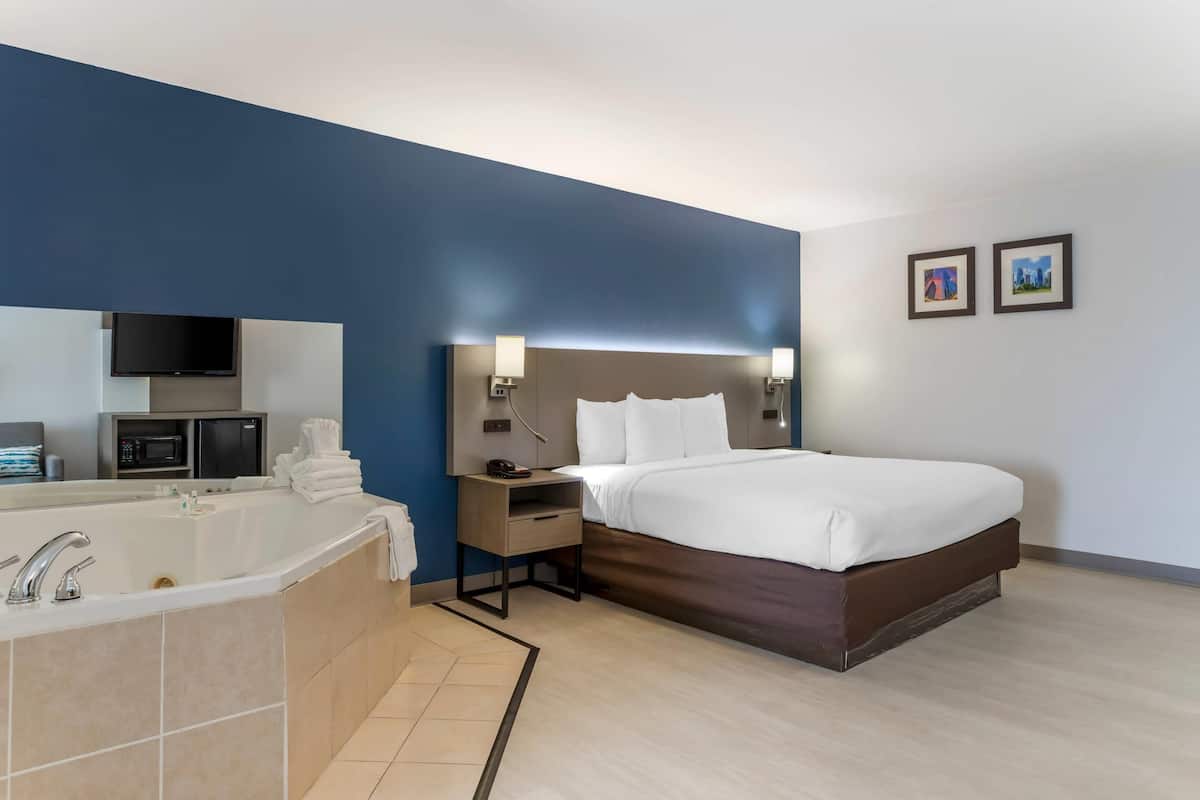 Suite, 1 King Bed, Non Smoking, Jetted Tub | Desk, iron/ironing board, free cots/infant beds, rollaway beds