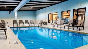 A swimming pool with chairs and a changing room. - Holiday Inn Express & Suites Hiawassee by IHG (Hiawassee)