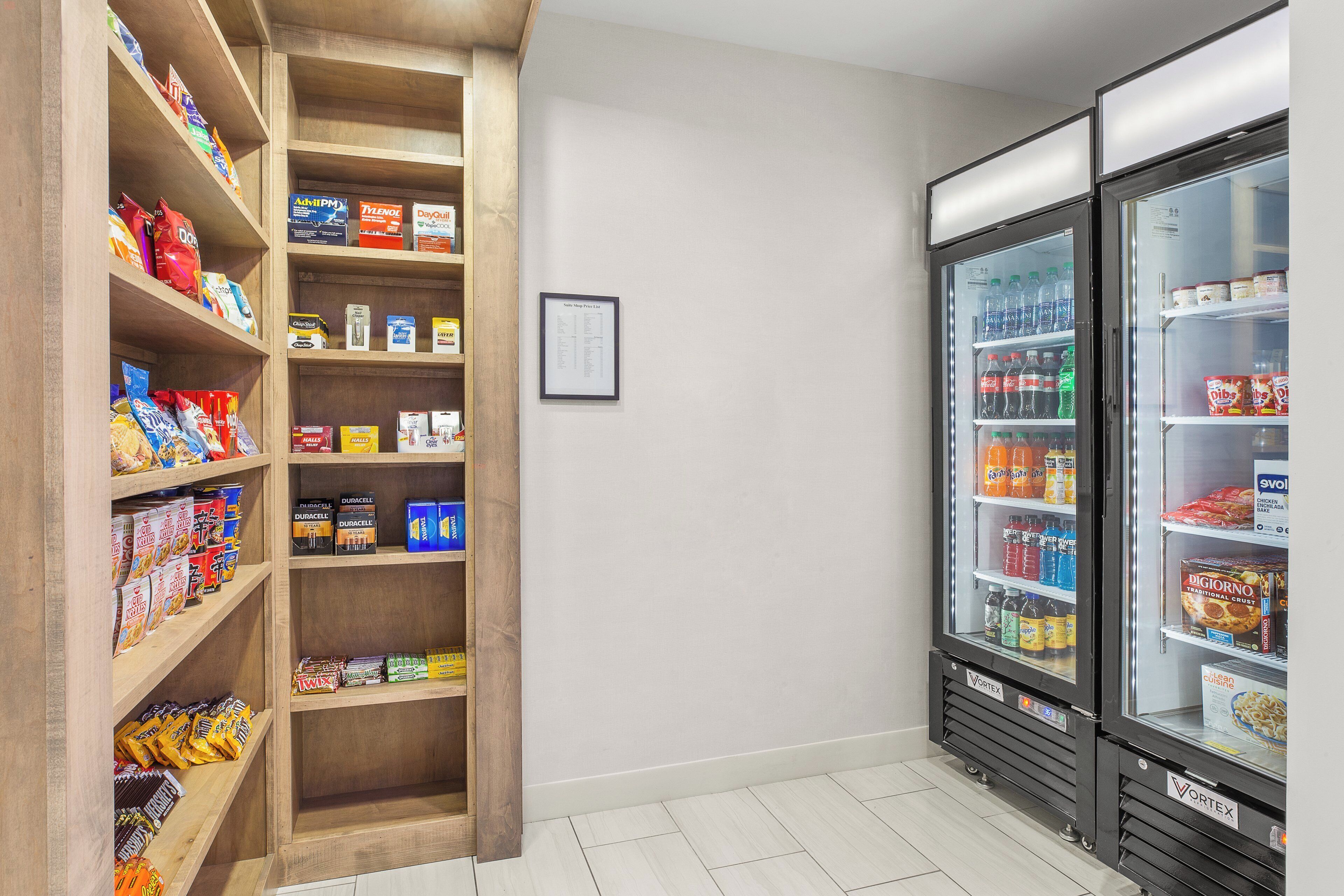 A snack and beverage vending area with various snacks and drinks.