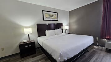 Premium bedding, pillow-top beds, desk, laptop workspace