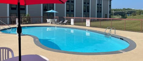 Seasonal outdoor pool, open 10:00 AM to 8:00 PM, pool umbrellas