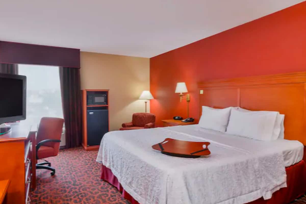 desk, laptop workspace, blackout curtains, iron/ironing board