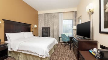 Enjoy a comfortable stay in this well-appointed room featuring a king-size bed, flat-screen TV, and kitchenette.