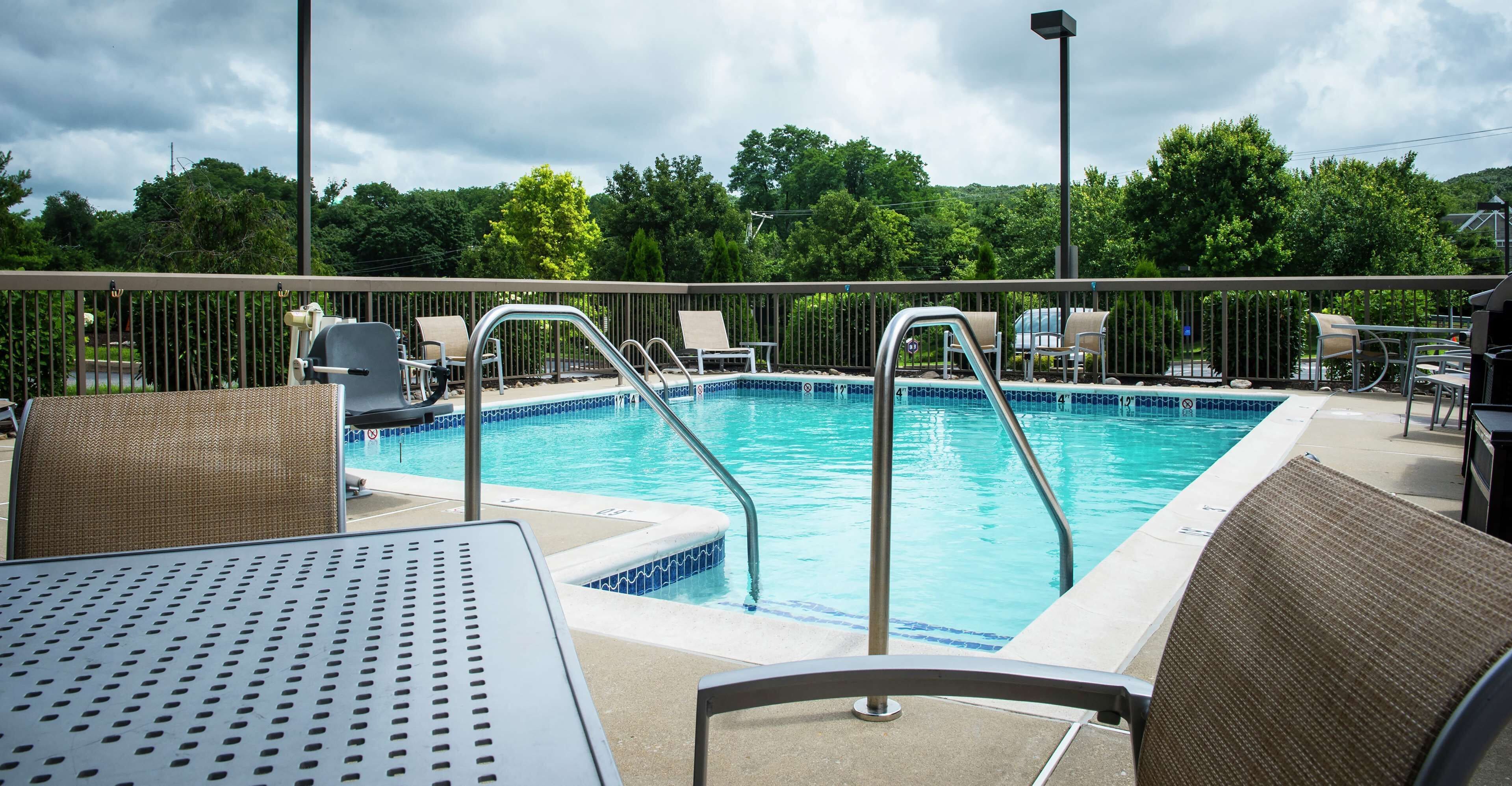 seasonal outdoor pool, open 8:00 am to 7:30 pm, pool loungers