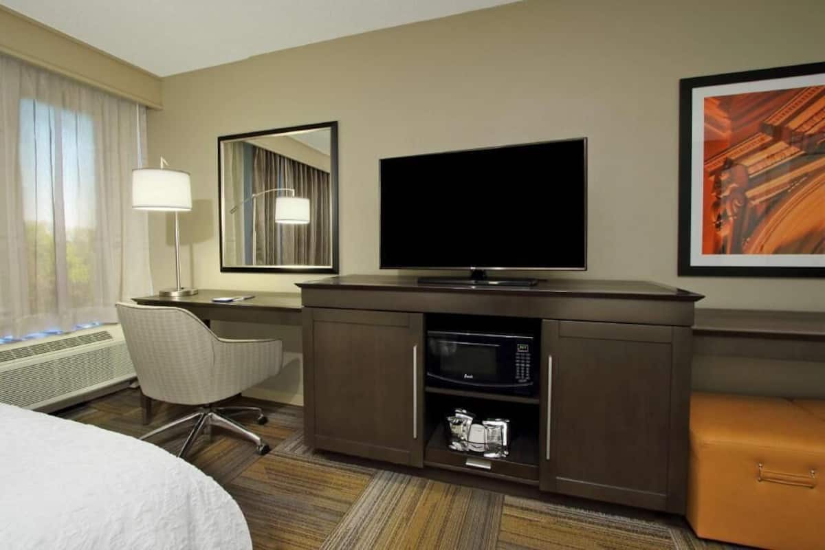 Desk, laptop workspace, blackout curtains, iron/ironing board