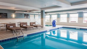 An indoor swimming pool with lounge chairs and a poolside area. - Hampton Inn Colorado Springs-Airport (Colorado Springs)