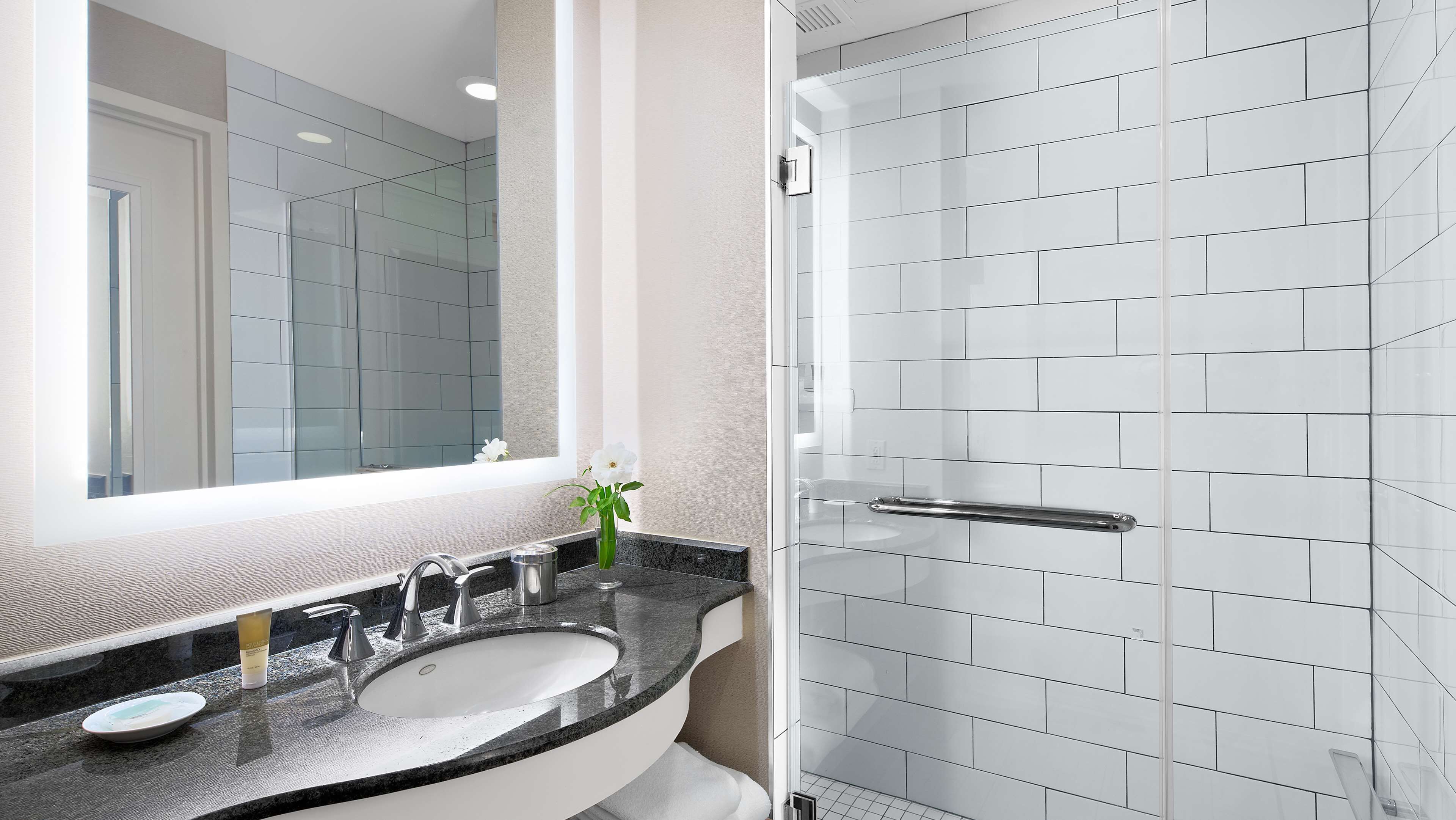 designer toiletries, hair dryer, towels, soap