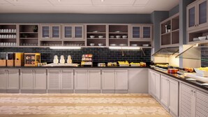 A modern kitchen with grey cabinets, black backsplash, and a patterned floor. - Hyatt Place Kansas City/Overland Park/Convention Center (Overland Park)
