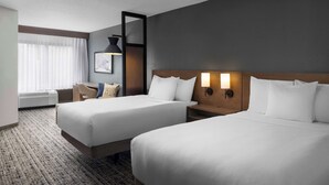 A hotel room with two beds, a desk, a chair, and a large window with curtains. - Hyatt Place Kansas City/Overland Park/Convention Center (Overland Park)