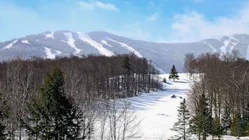 A snowy mountain landscape with a clear sky.