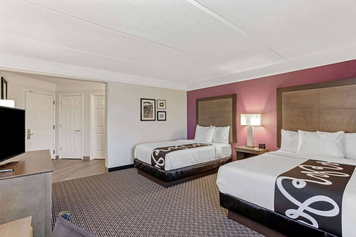 Premium bedding, pillowtop beds, desk, laptop workspace