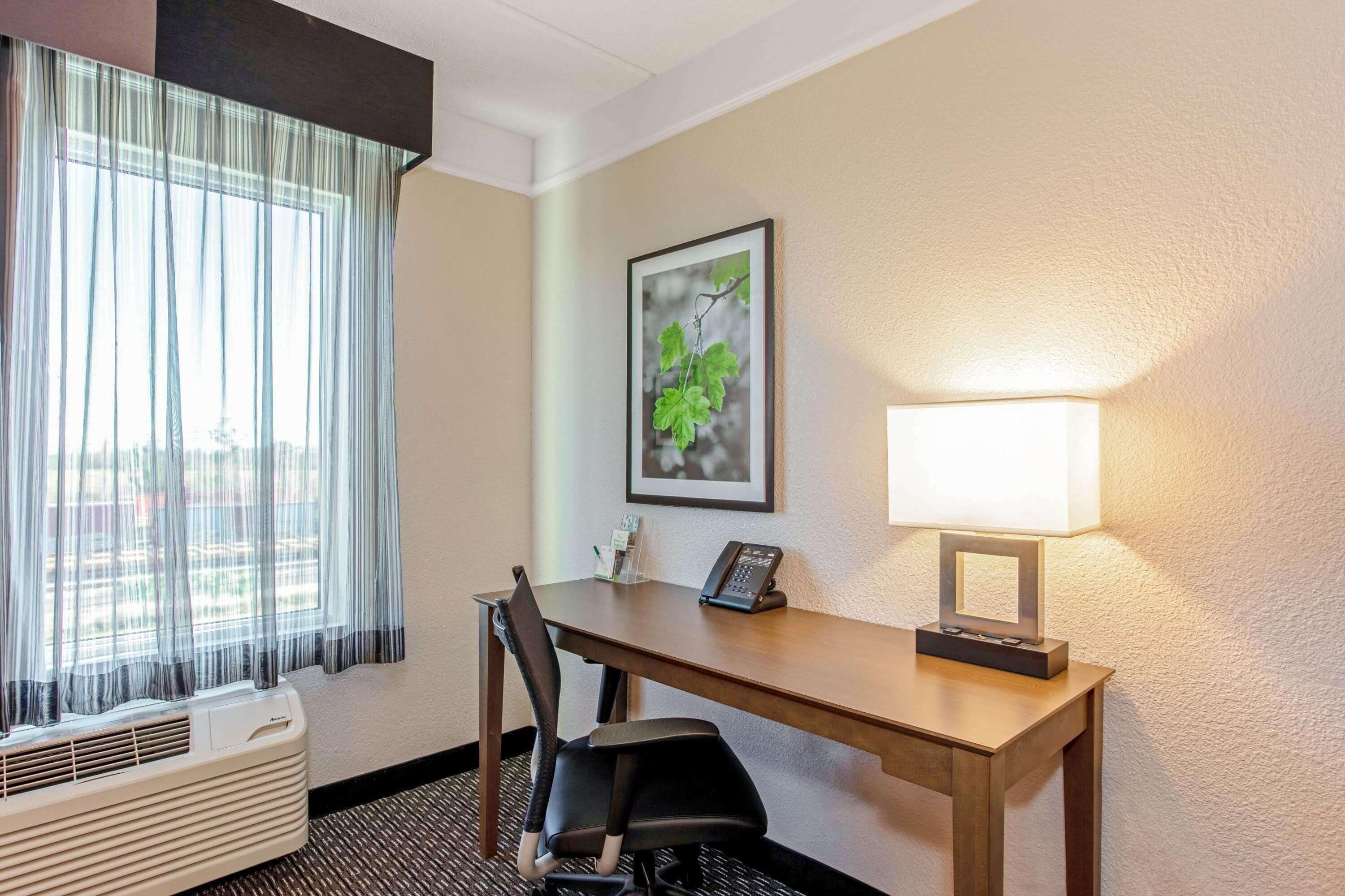 premium bedding, pillow-top beds, desk, laptop workspace