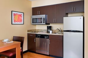 Full-size fridge, microwave, stovetop, coffee/tea maker