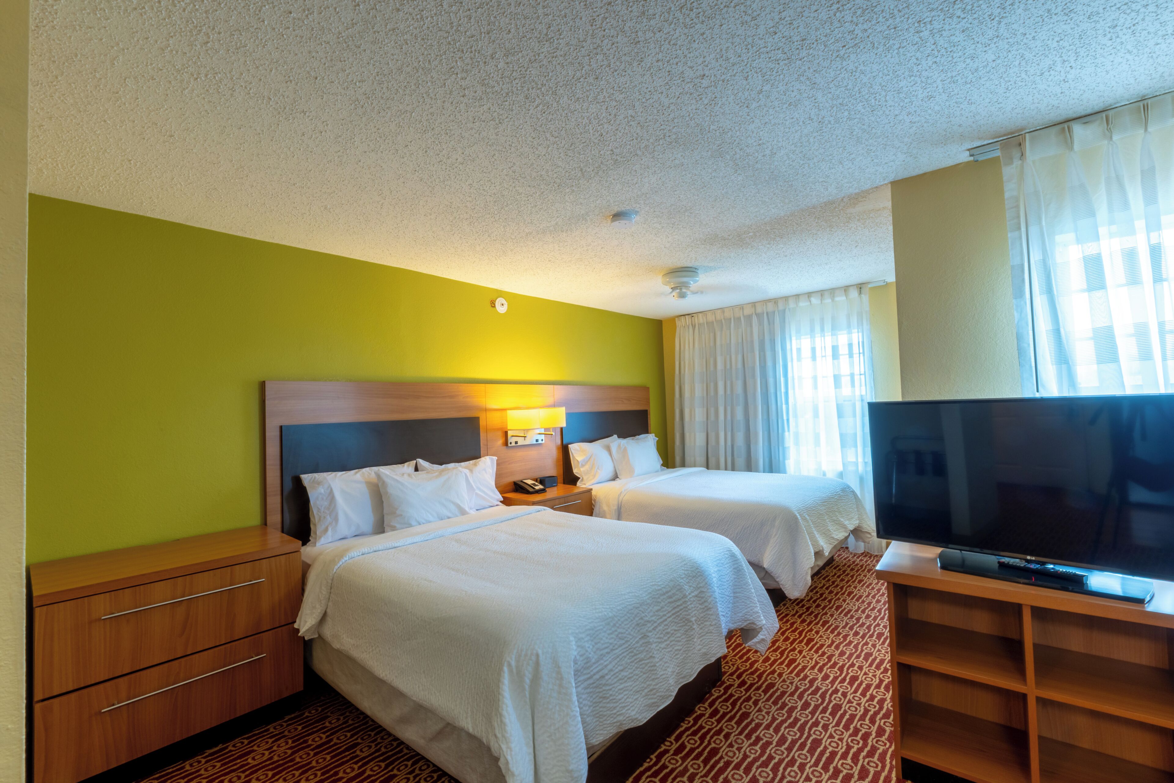 Studio Suite, 2 Queen Beds | In-room safe, desk, iron/ironing board, free cribs/infant beds