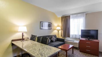 Desk, laptop workspace, iron/ironing board, free cribs/infant beds