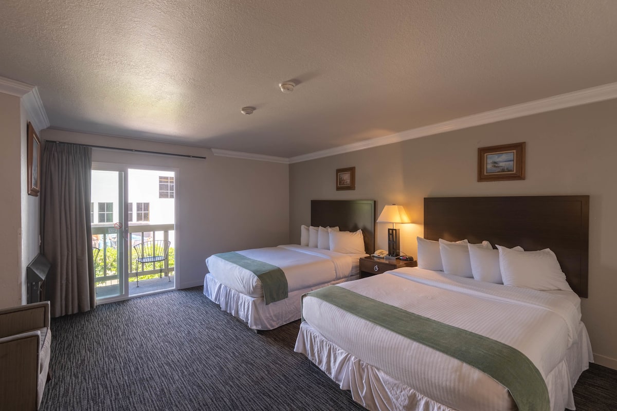 deluxe room, 2 queen beds, fireplace | 1 bedroom, premium bedding, down duvets, desk