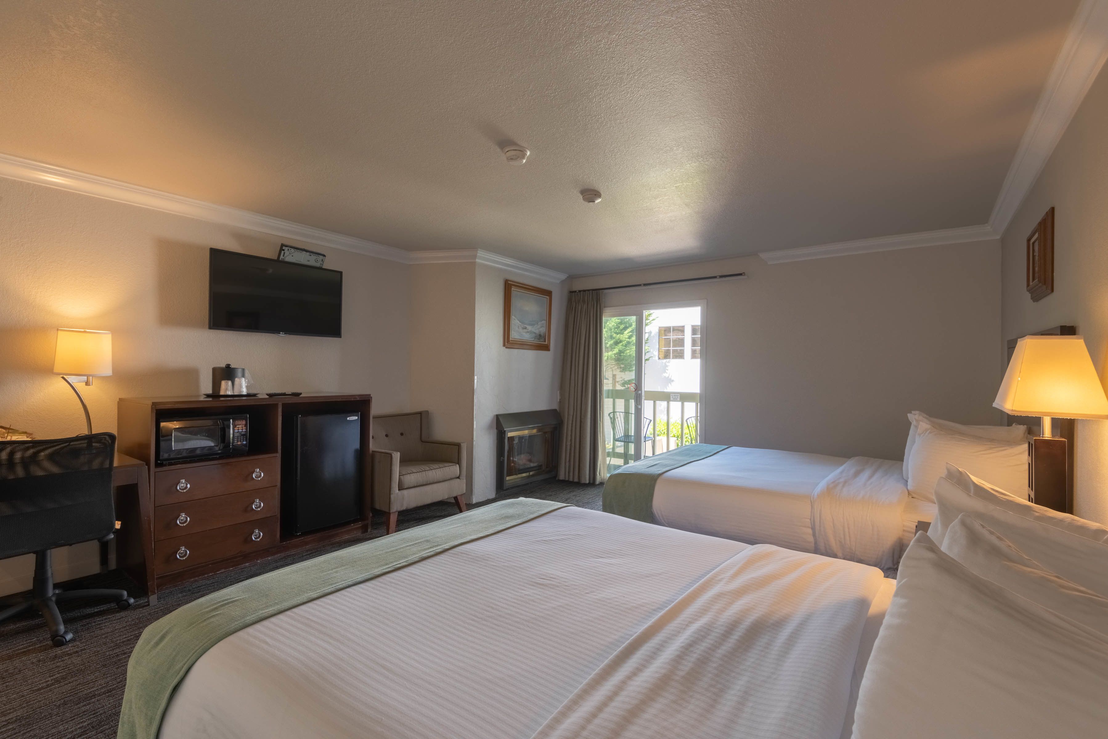 deluxe room, 2 queen beds, fireplace | 1 bedroom, premium bedding, down duvets, desk