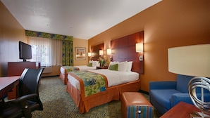 A hotel room with two beds, a desk with a chair, a TV, and a sofa. - Best Western Plus Fresno Inn (Fresno)