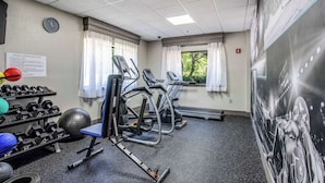 A fitness center with treadmills, dumbbells, and exercise balls. - Clarion Pointe Franklin - Nashville Area (Franklin)