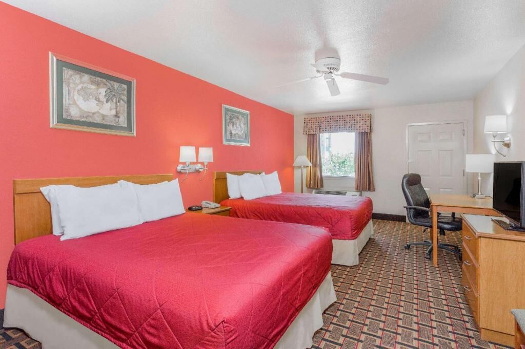 Desk, laptop workspace, blackout drapes, free cribs/infant beds