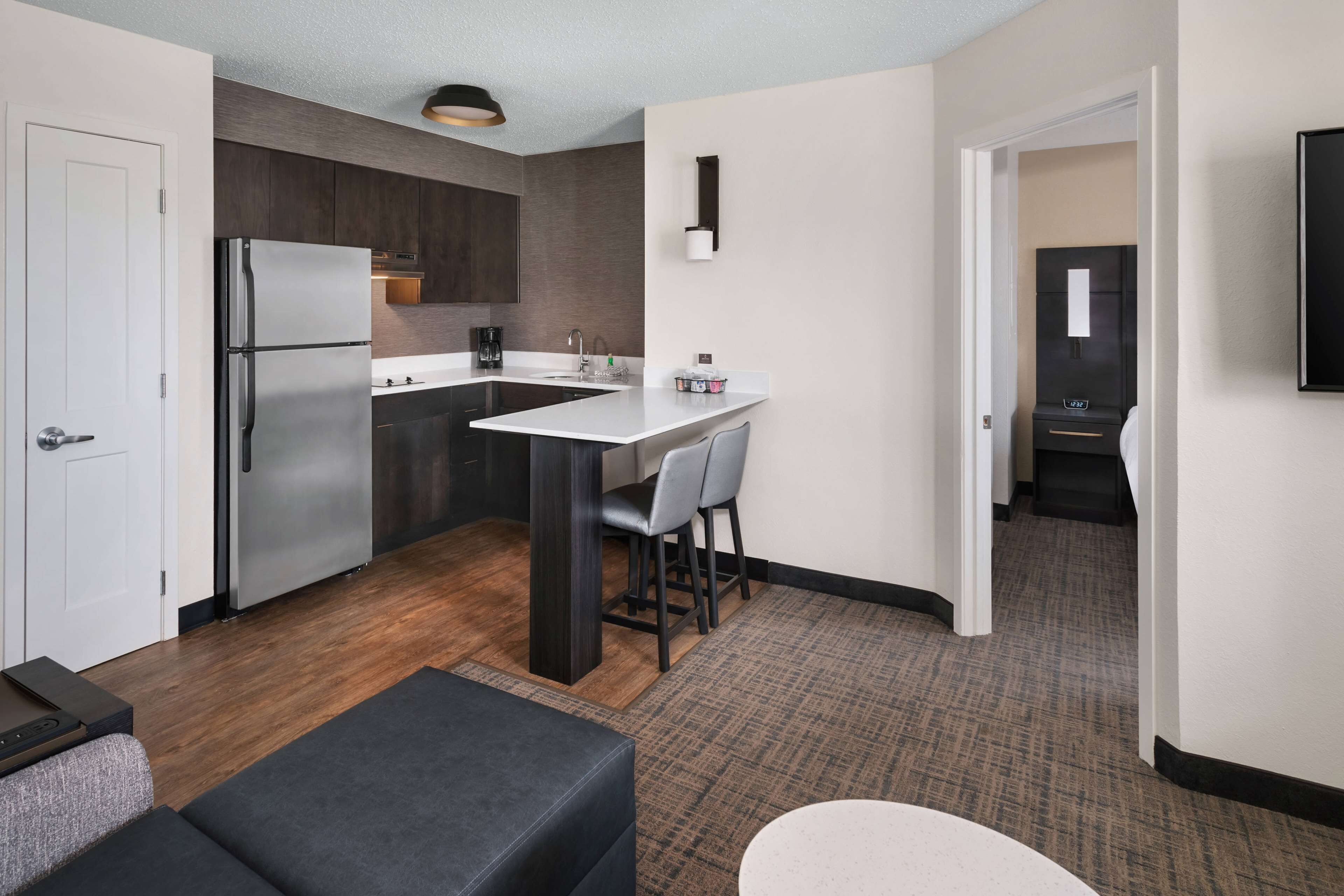 full-sized fridge, microwave, stovetop, coffee/tea maker